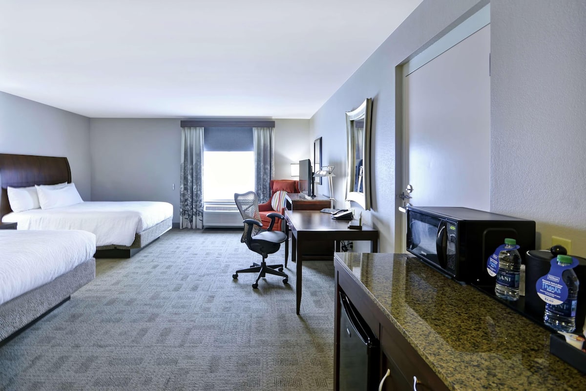 Premium bedding, desk, laptop workspace, iron/ironing board