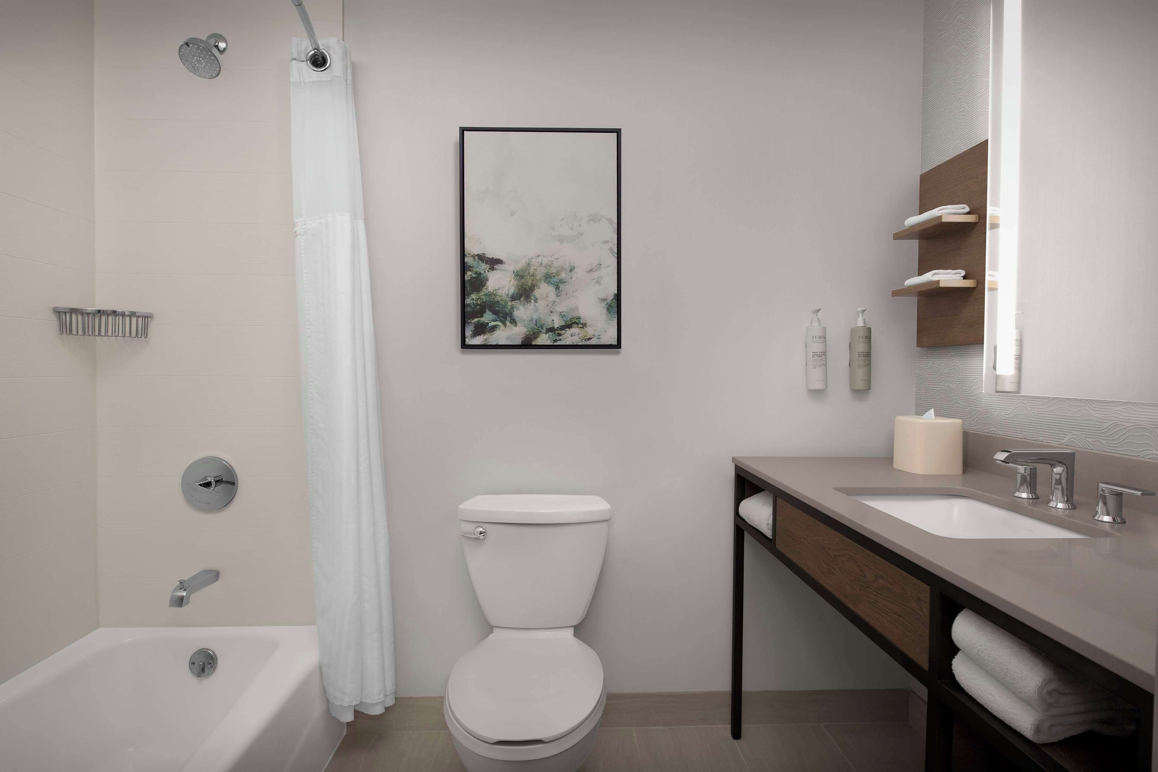 two queen bed evolution room | bathroom | hair dryer, towels