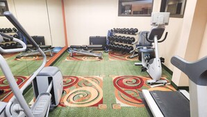 A gym with treadmills, elliptical machines, and a rack of dumbbells. - Country Inn & Suites by Radisson, Tyler University Area (Tyler)