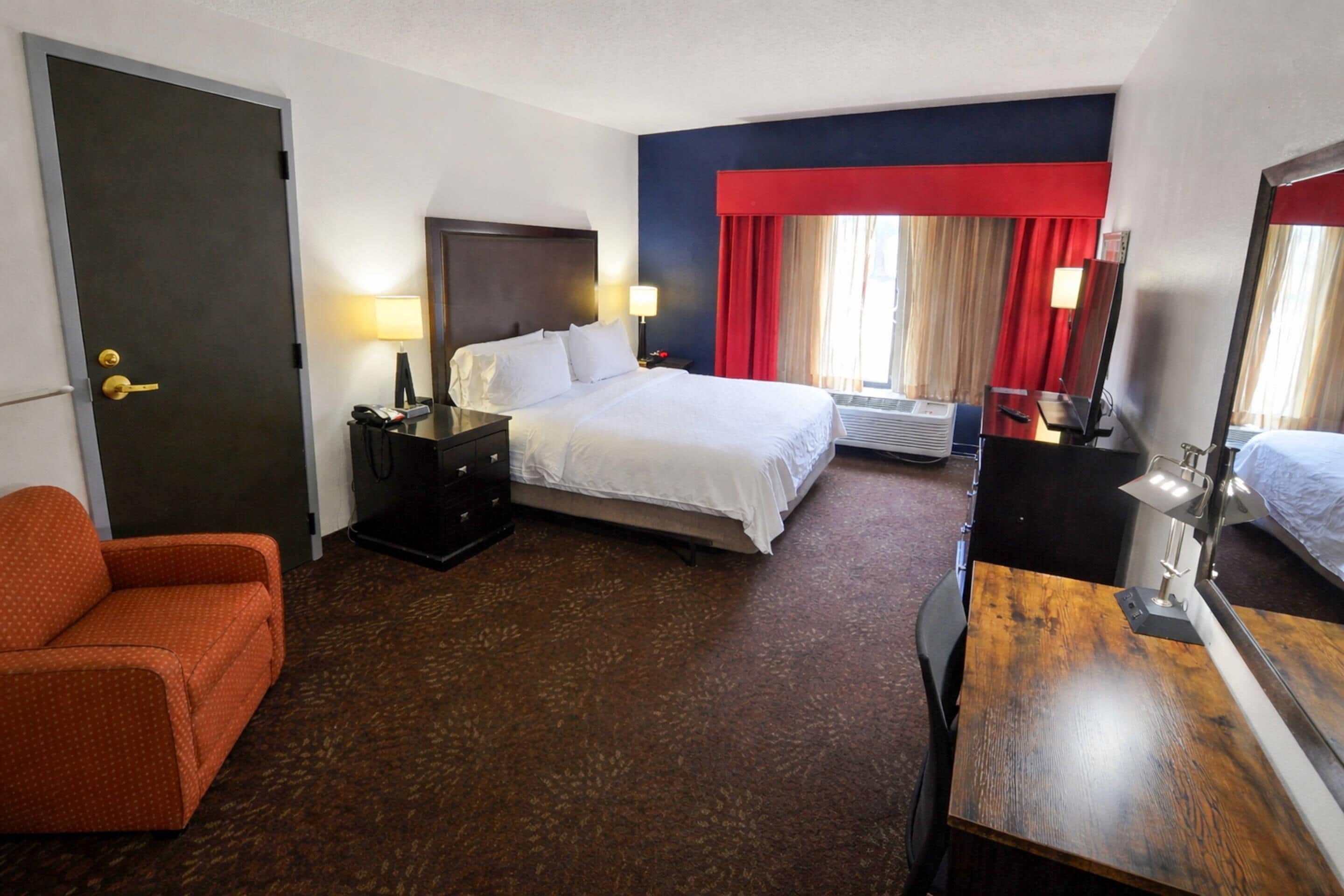 Room, 1 King Bed, Roll-in Shower, Non Smoking | In-room safe, desk, laptop workspace, blackout drapes