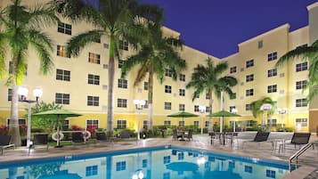 Outdoor pool, open 7:00 AM to 7:00 PM, pool loungers