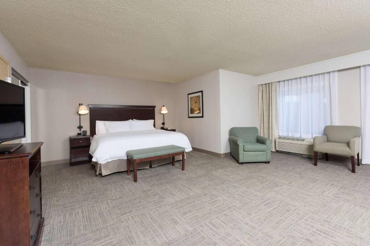 Premium bedding, laptop workspace, blackout drapes, iron/ironing board