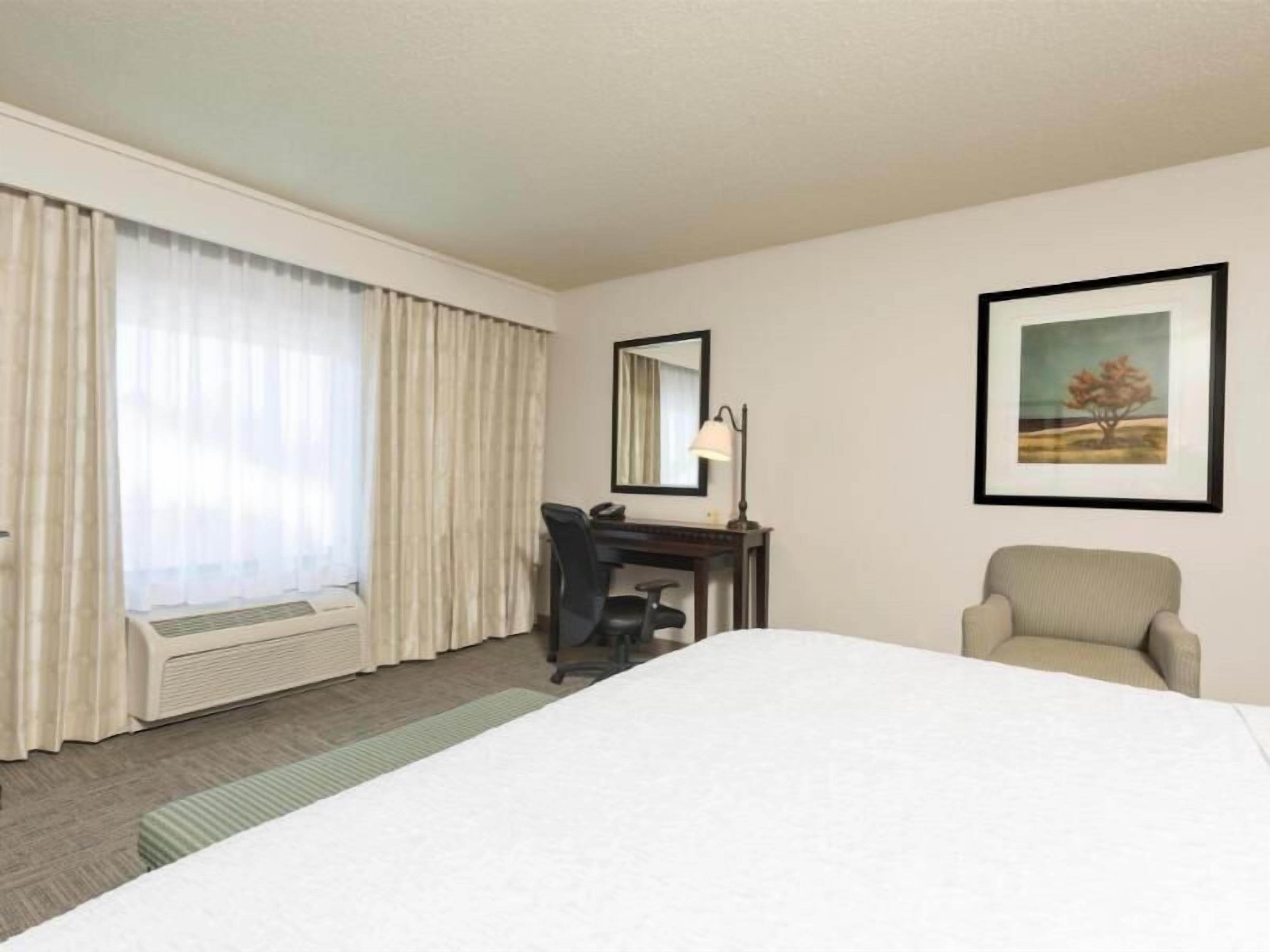Premium bedding, laptop workspace, blackout drapes, iron/ironing board