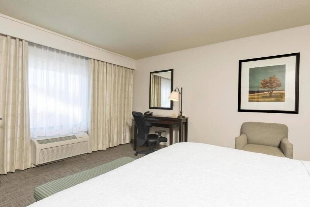Premium bedding, laptop workspace, blackout drapes, iron/ironing board
