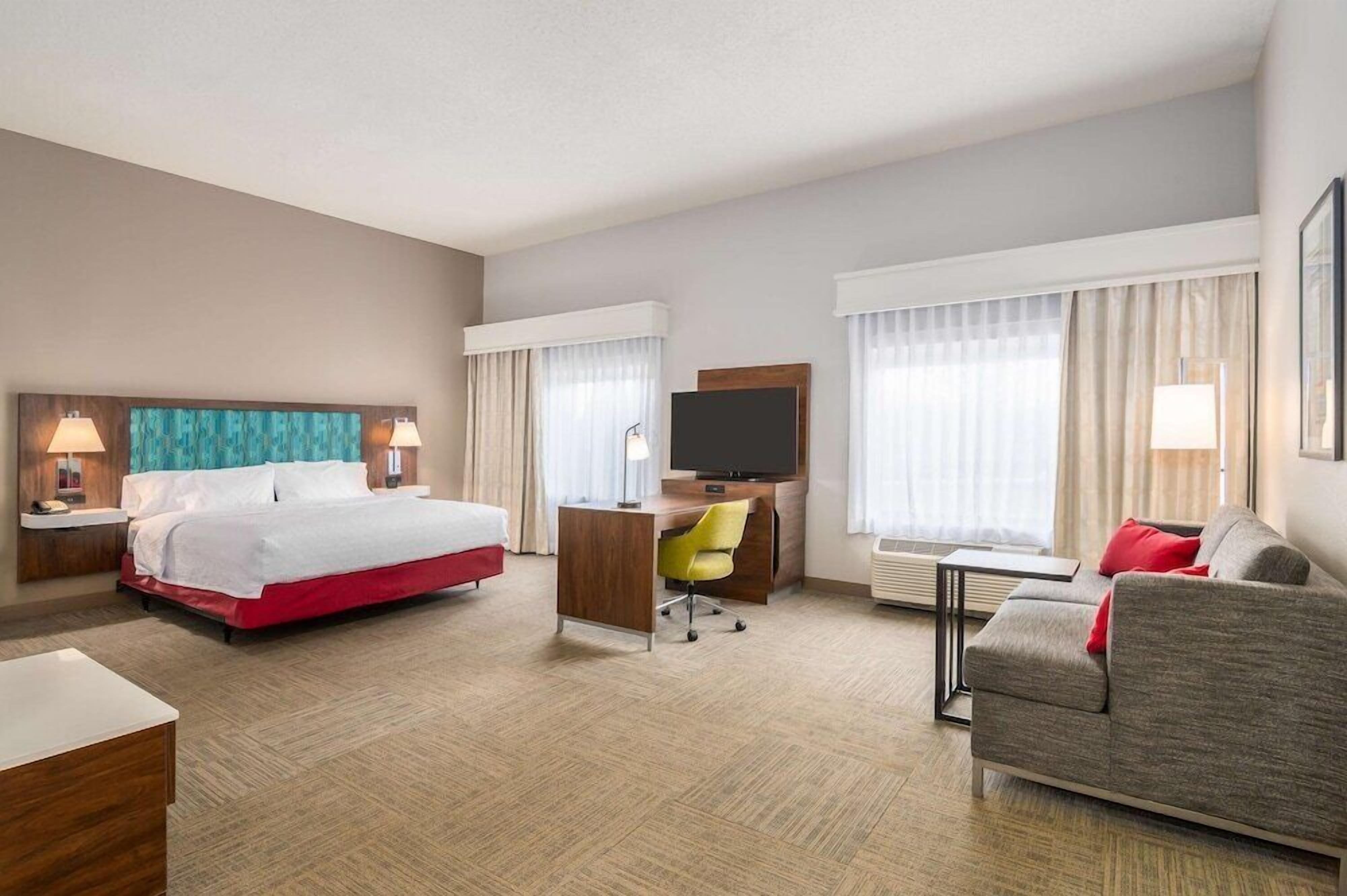 Premium bedding, laptop workspace, blackout drapes, iron/ironing board