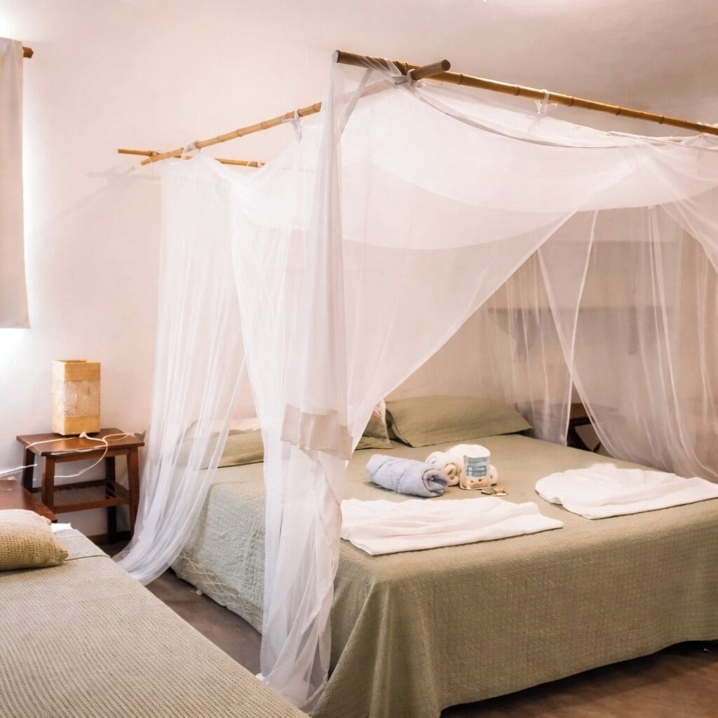 Habitación económica | Minibar, caja de seguridad en la habitación y ropa de cama 