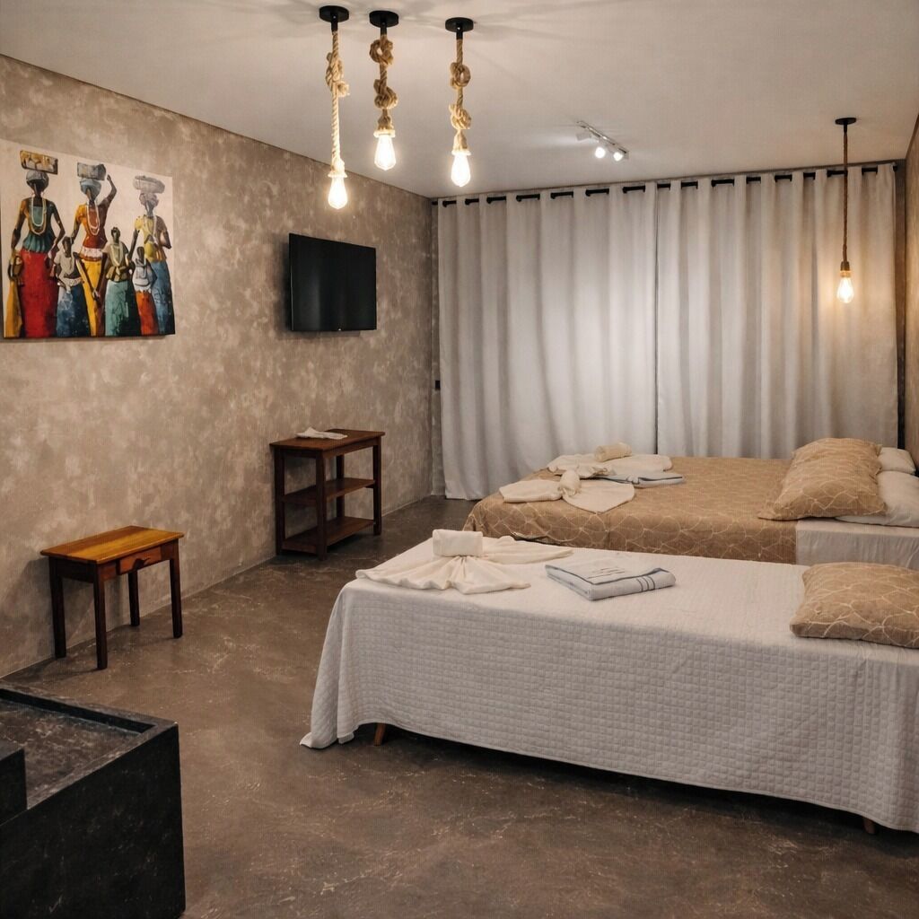 Habitación clásica, vista al mar (TPL) | Minibar, caja de seguridad en la habitación y ropa de cama 