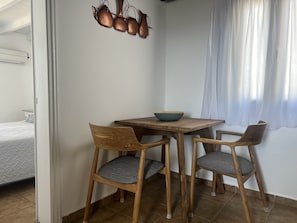 Superior one Bedroom Apartment with outdoor Hot Tub | Living area | 24-inch flat-screen TV with satellite channels, TV - Aspa Villas (Santorini)