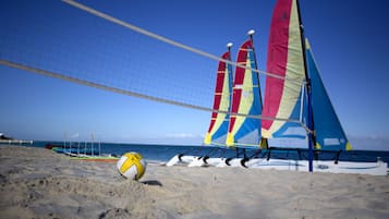 On the beach, white sand, sun loungers, beach massages