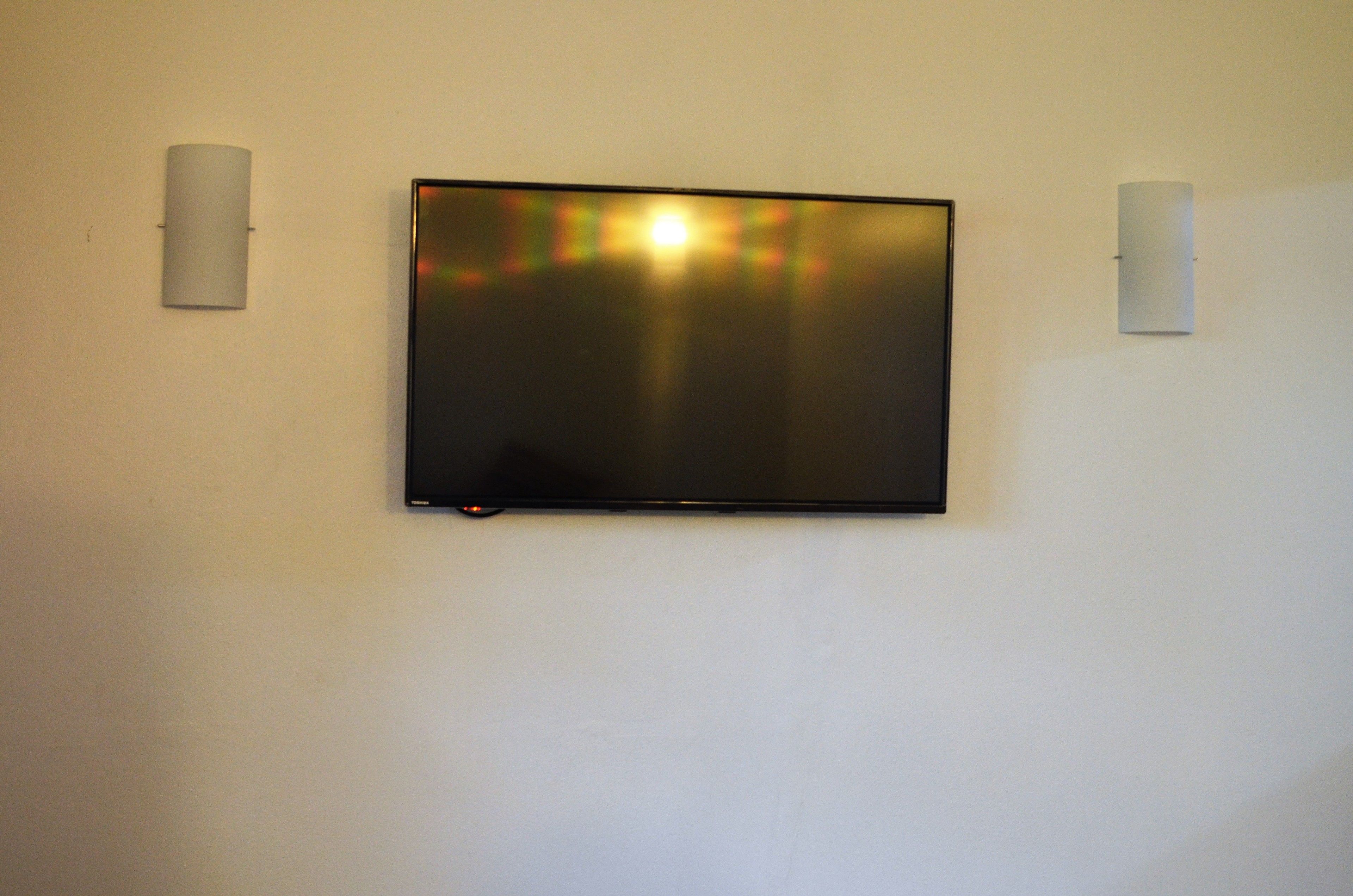 deluxe villa, 2 bedrooms | living area | 32-inch flat-screen tv with satellite channels, tv, first-run films