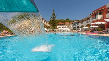 Outdoor pool, open 10:00 AM to 7:00 PM, pool umbrellas, pool loungers