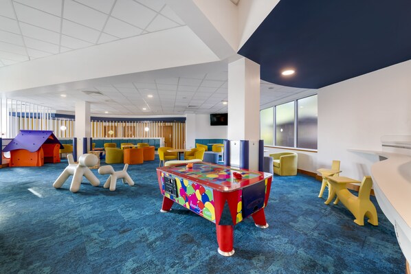 A children's play area with colorful furniture and a blue carpet. - Pine Lake Resort (Carnforth)