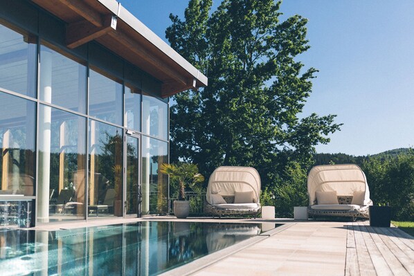 Indoor pool, outdoor pool, pool umbrellas, pool loungers