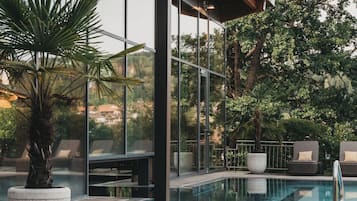 Indoor pool, outdoor pool, pool umbrellas, pool loungers