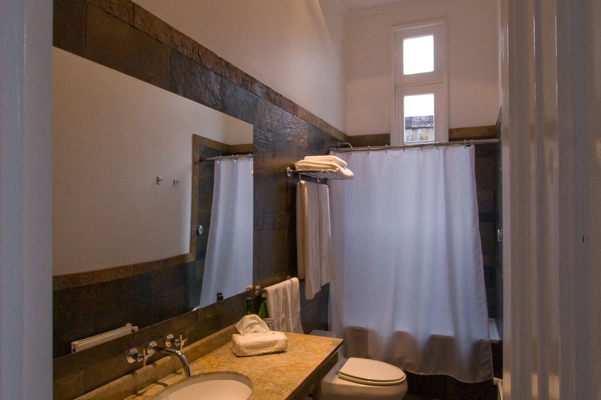 combined shower/bathtub, deep-soaking bathtub, designer toiletries