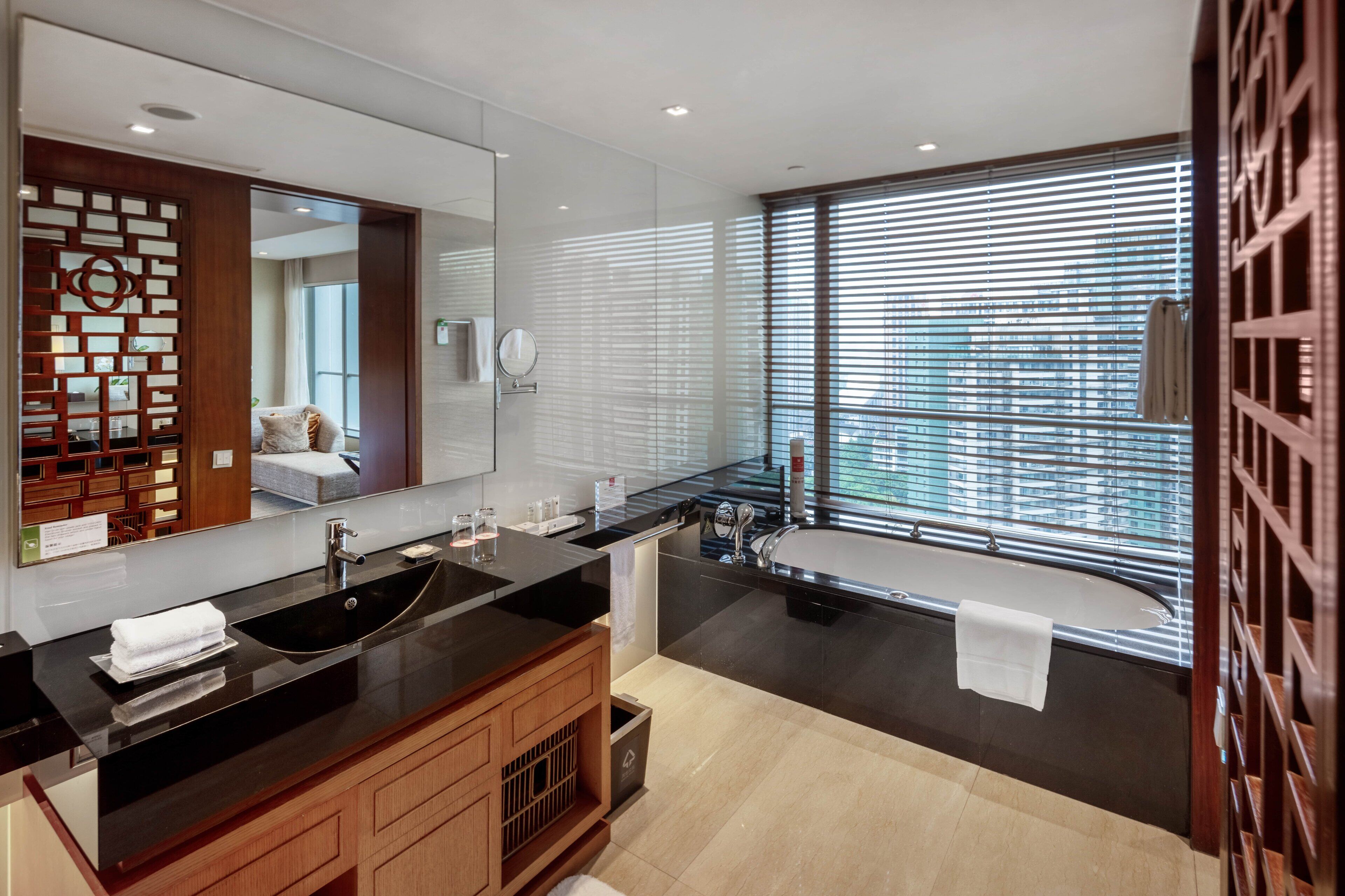 separate bathtub and shower, rainfall showerhead, designer toiletries