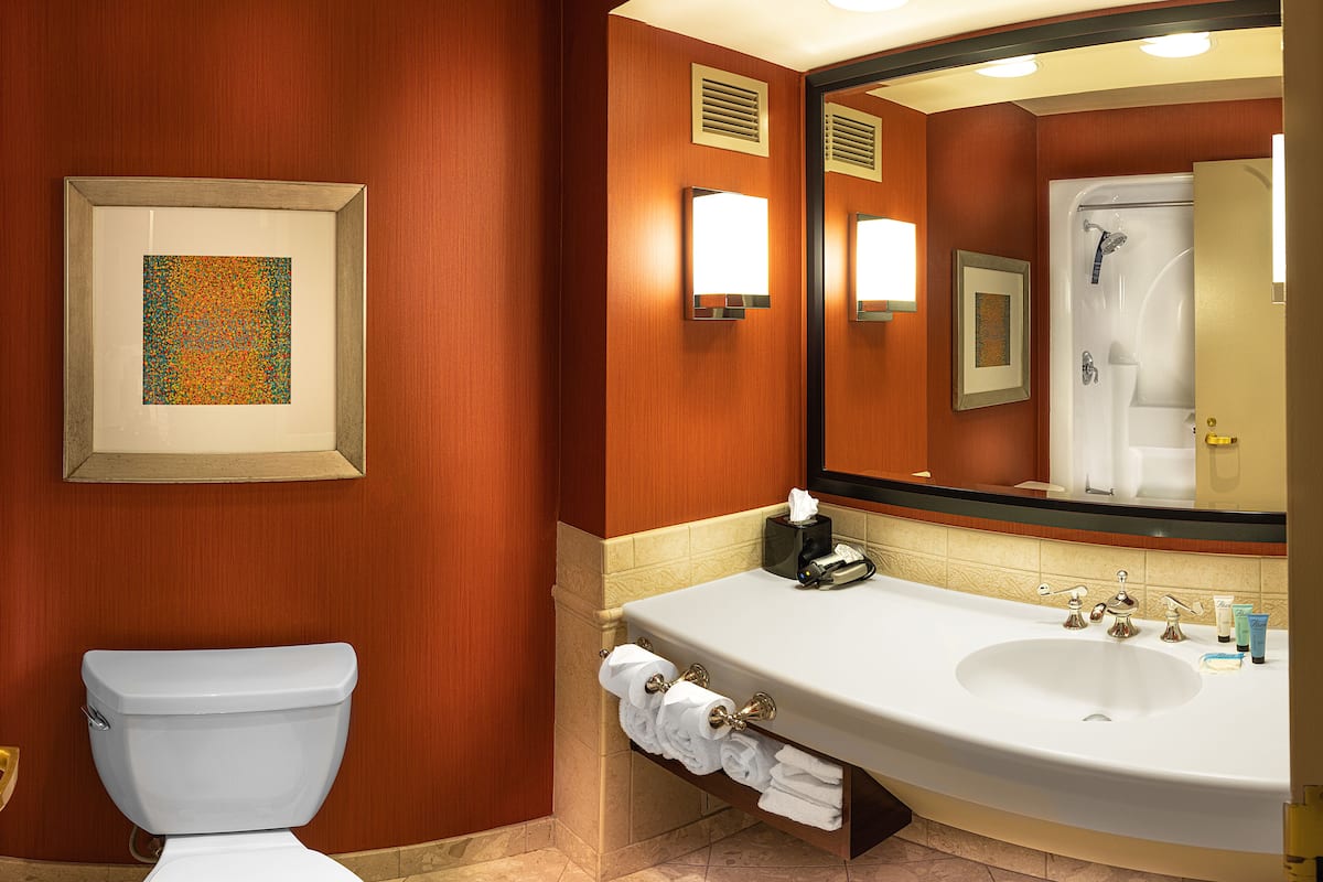 Combined shower/tub, designer toiletries, hair dryer, towels