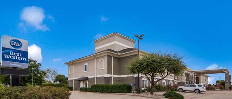 A Best Western hotel with a large parking lot and a covered entrance.