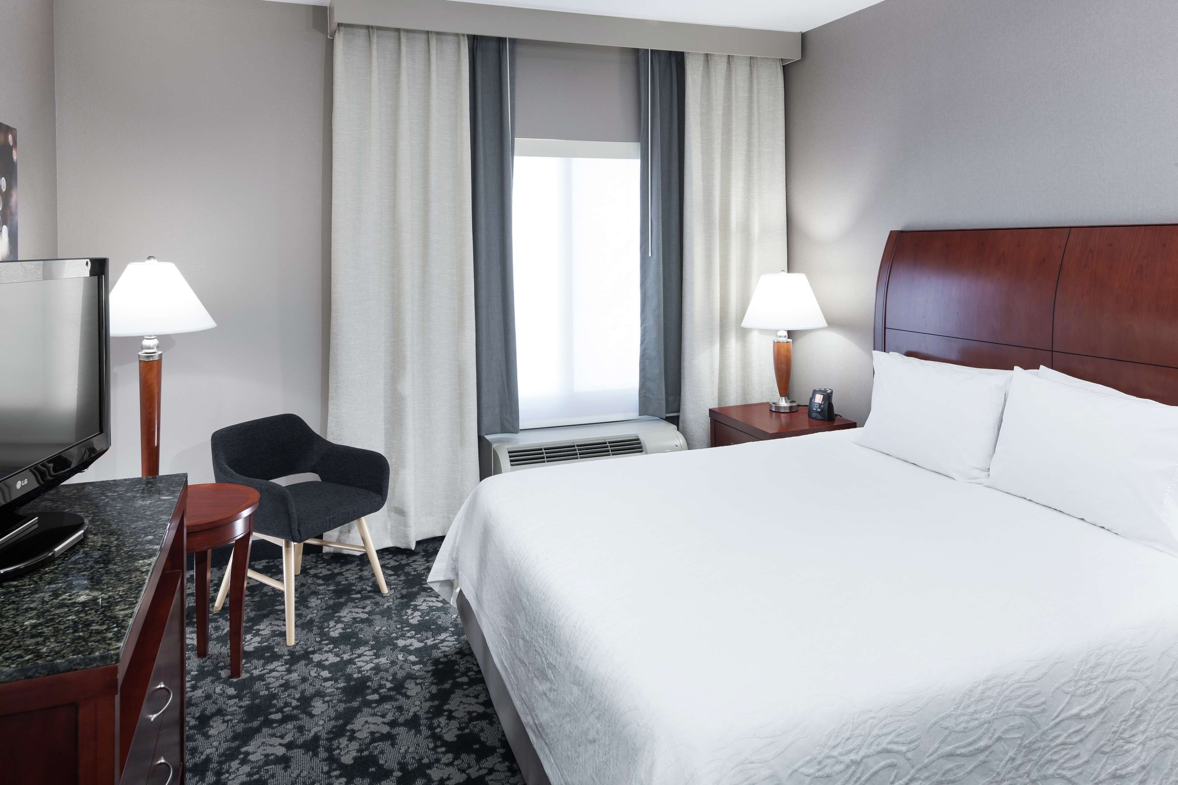 deluxe suite, one king bed | premium bedding, down duvets, pillow-top beds, in-room safe
