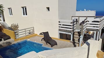 Seasonal outdoor pool, pool umbrellas, pool loungers