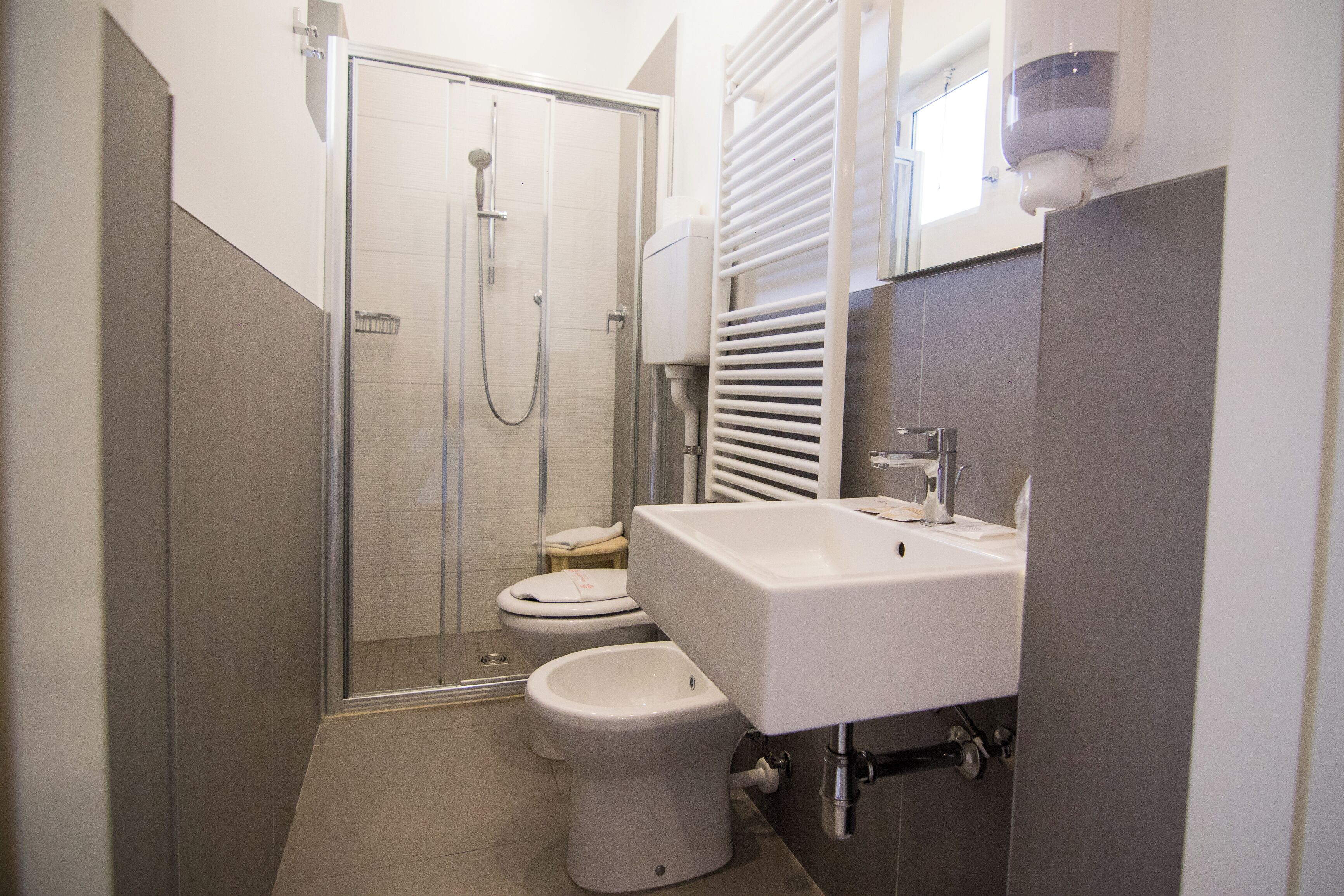 shower, hair dryer, bidet, towels