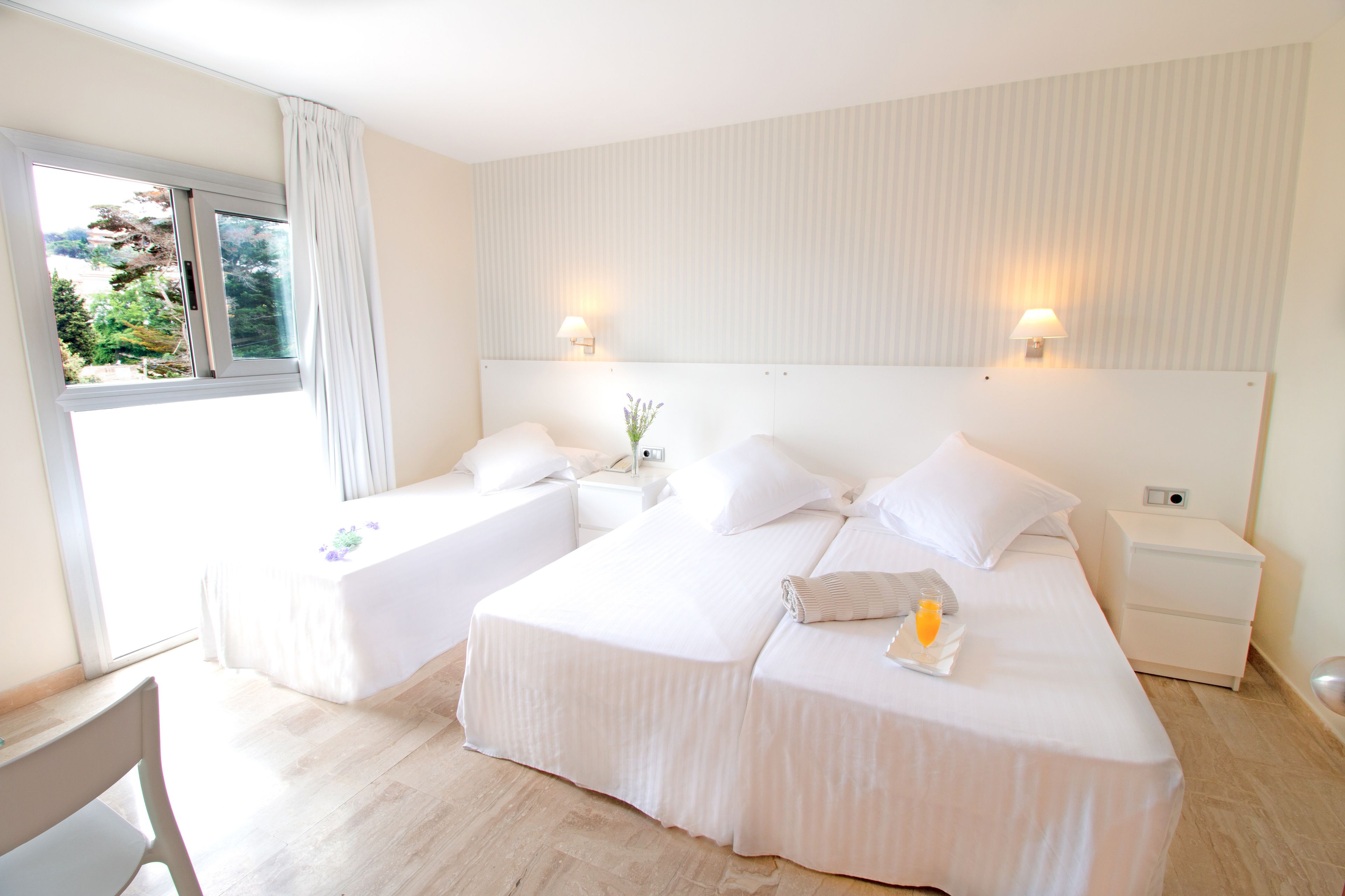 triple room | premium bedding, minibar, in-room safe, blackout curtains