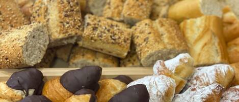 A variety of baked goods including bread, croissants, and pastries.