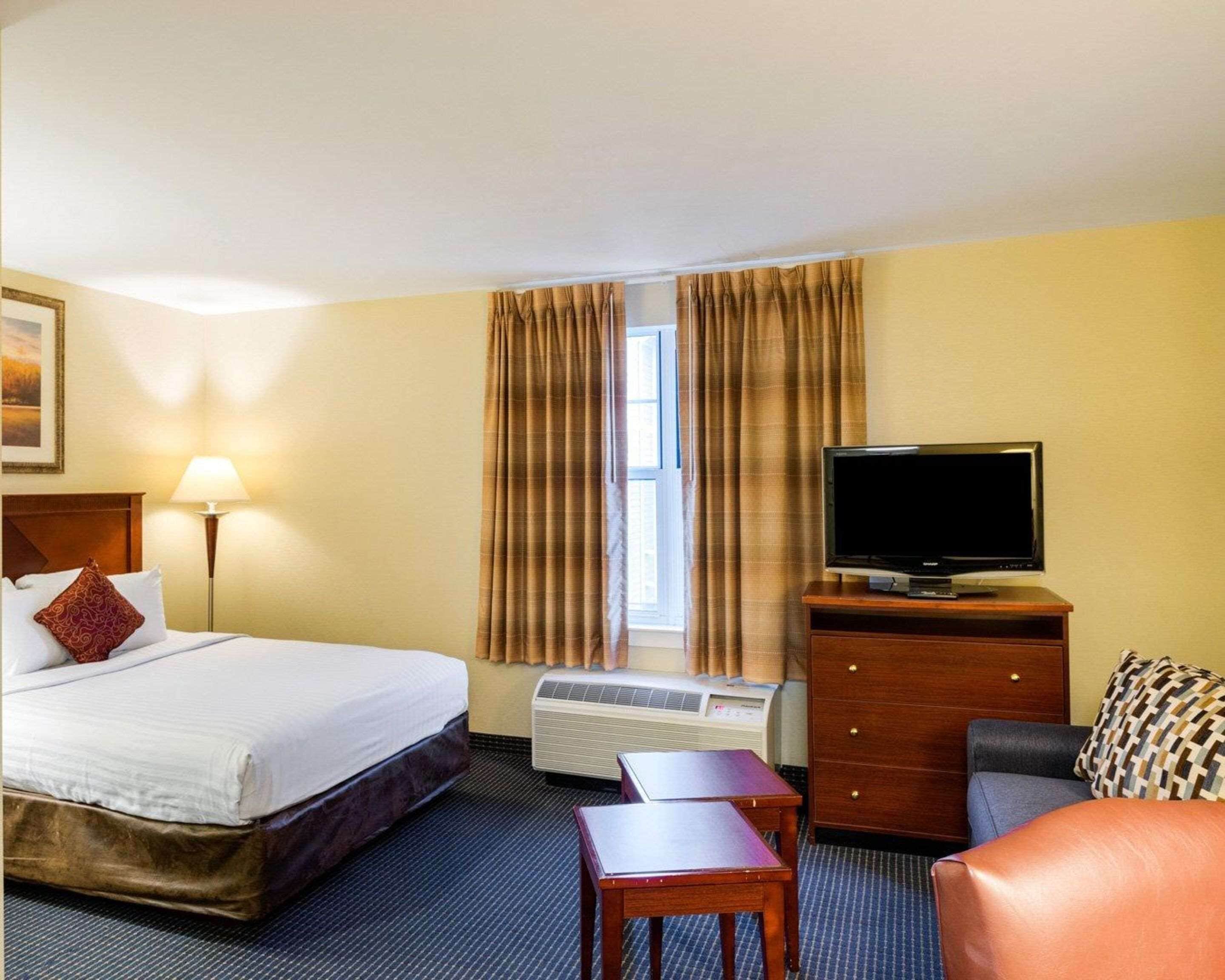 suite, 1 king bed, non smoking | in-room safe, desk, iron/ironing board, free cots/infant beds
