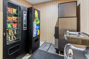 A vending machine with snacks and a Gatorade cooler, and a refrigerator with a water dispenser.