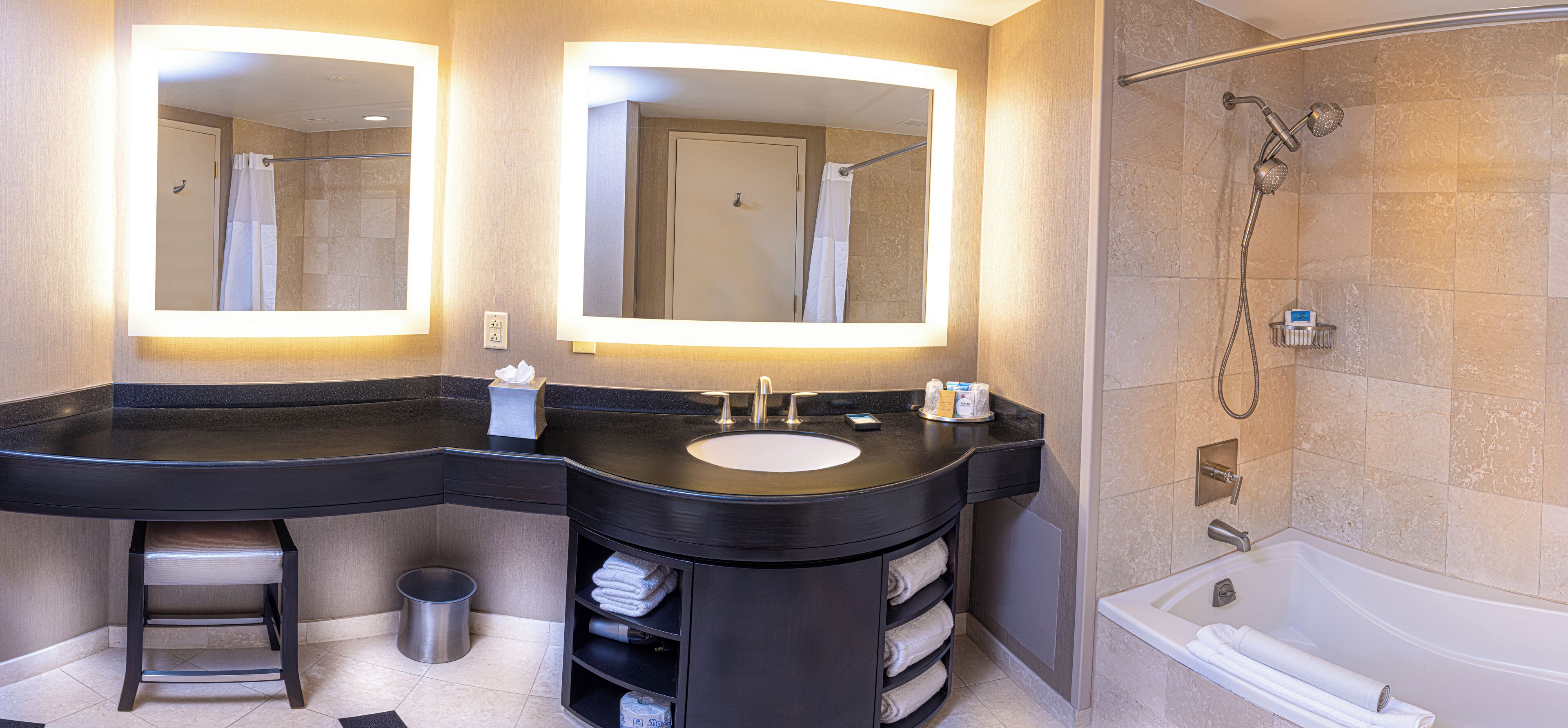 combined shower/bathtub, designer toiletries, hair dryer, towels