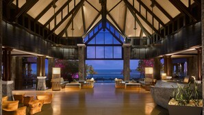 A spacious lobby with a high ceiling and large windows, offering a view of the ocean. - The Westin Turtle Bay Resort & Spa, Mauritius (Balaclava)
