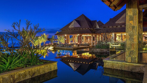 A resort with a pool, outdoor seating, and a night-time view of the sky. - The Westin Turtle Bay Resort & Spa, Mauritius (Balaclava)