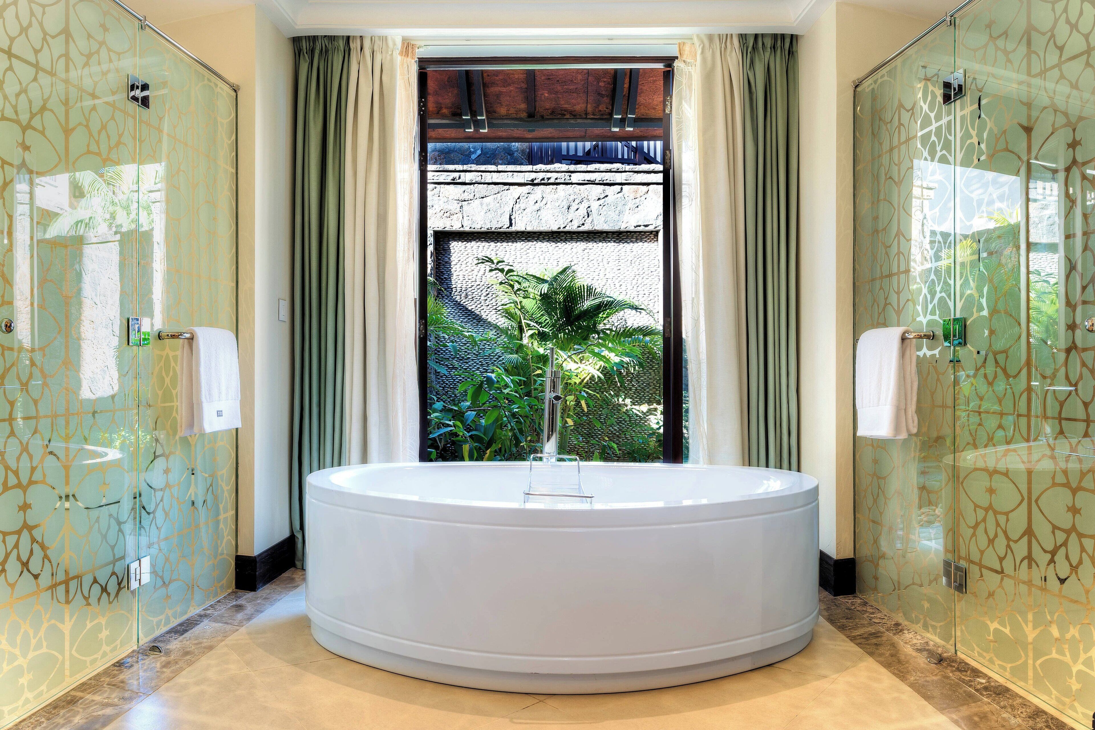 separate bathtub and shower, designer toiletries, hair dryer, bathrobes