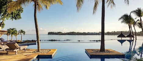2 outdoor pools, pool umbrellas, pool loungers