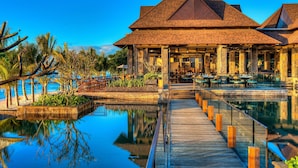 A resort with a pool, wooden deck, and outdoor seating area. - The Westin Turtle Bay Resort & Spa, Mauritius (Balaclava)