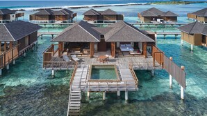 Overwater bungalows with private pools, wooden walkways, and ocean views. - Villa Nautica Paradise Island Resort (Lankanfinolhu)