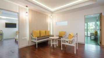 Family Suite, 2 Bedrooms | Living area | 43-inch Smart TV with cable channels