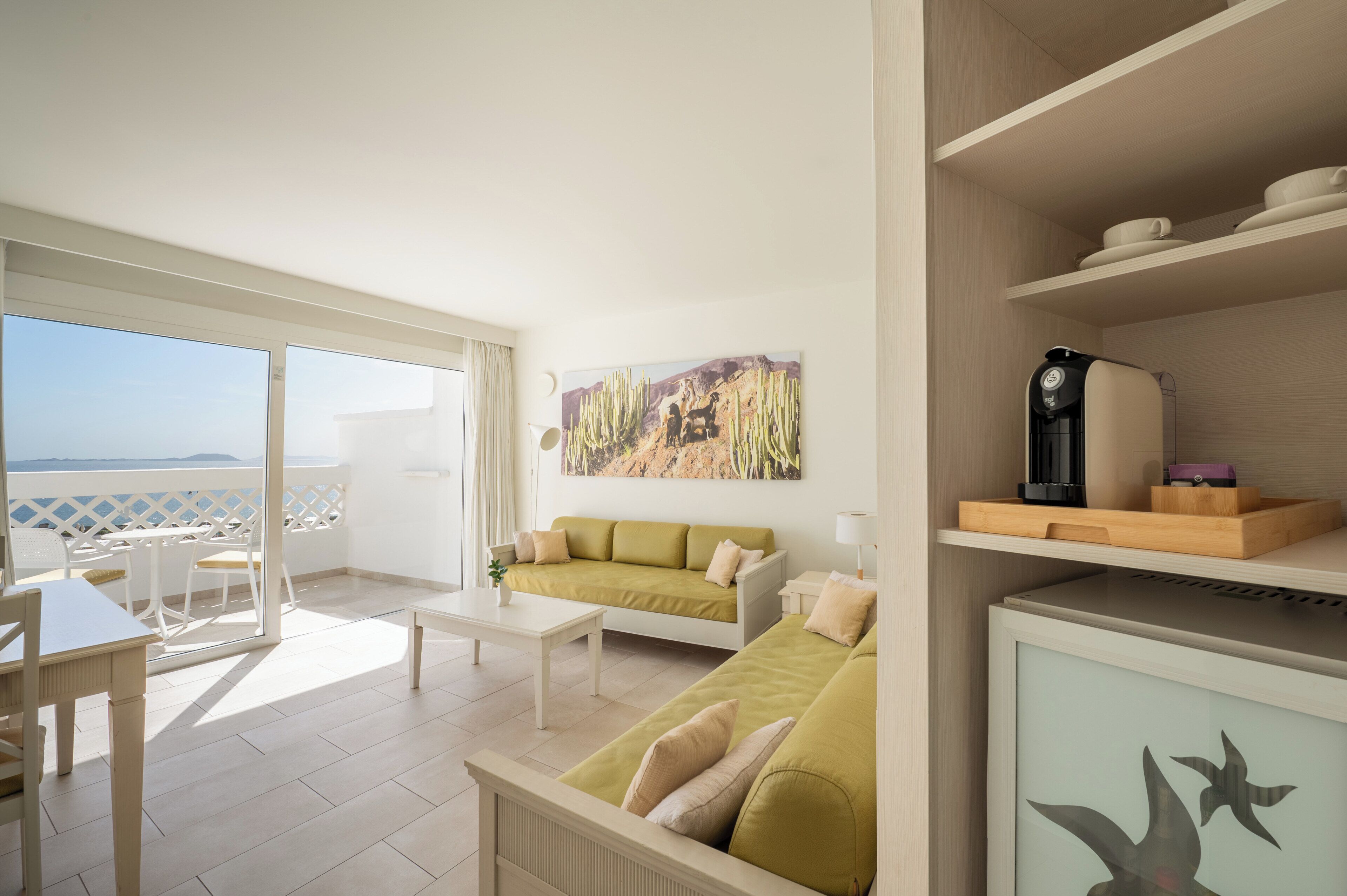 Family Room, Sea View | Minibar, in-room safe, individually decorated, individually furnished