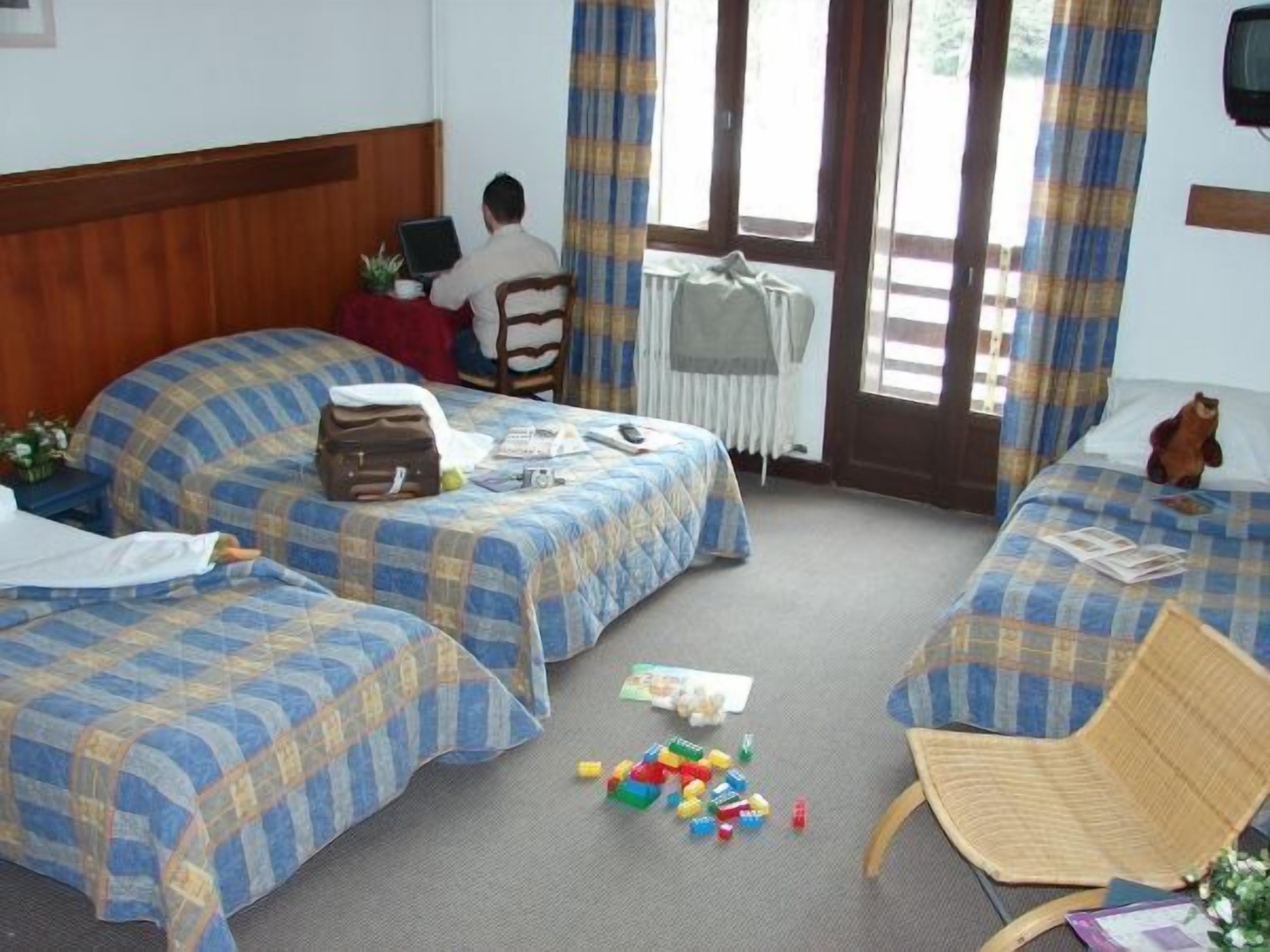 Family Room | Desk, blackout curtains, soundproofing, iron/ironing board