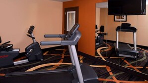 A hotel room with a treadmill, elliptical, and stationary bike. - Quality Inn Appleton West (Appleton)