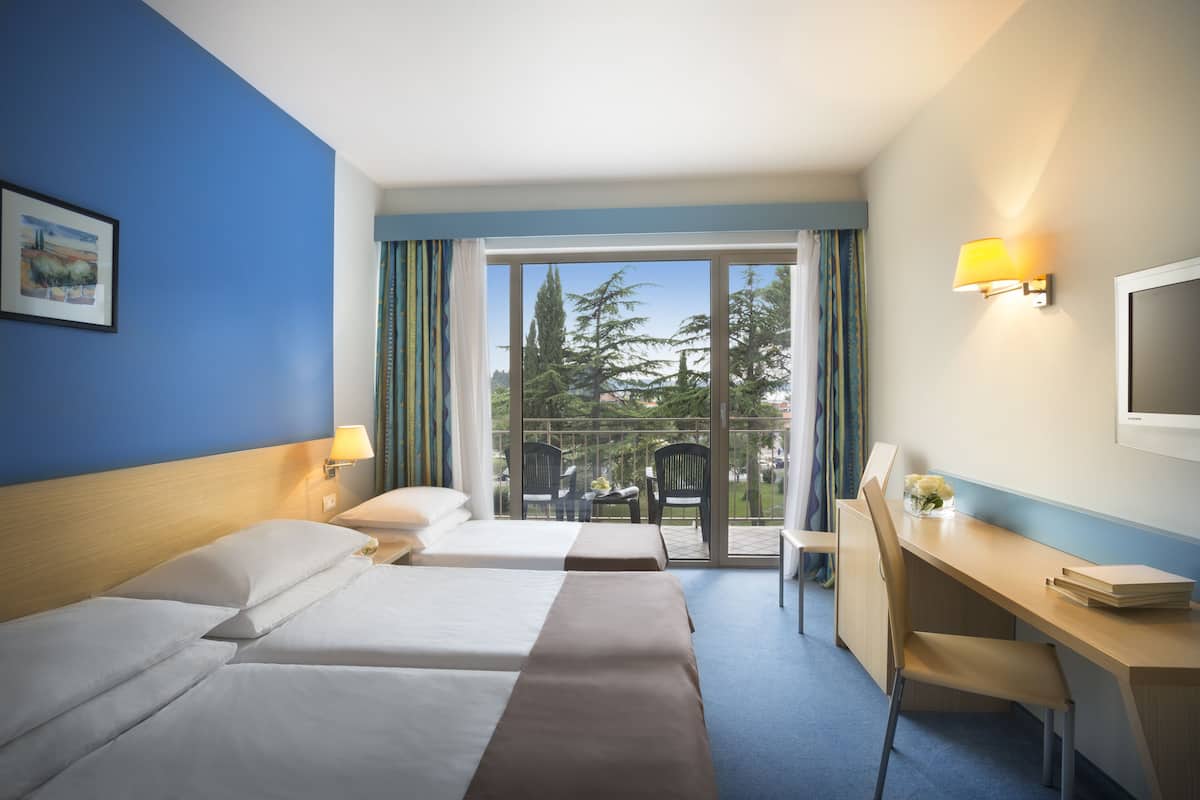 standard triple room, balcony, park view | 1 bedroom, in-room safe, desk, cots/infant beds