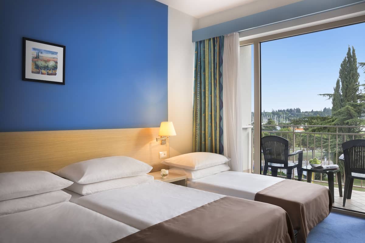 standard triple room, balcony, park view | 1 bedroom, in-room safe, desk, cots/infant beds