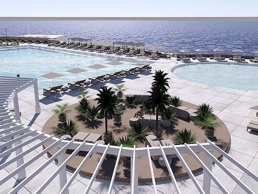 Een seizoensgebonden buitenzwembad en parasols bij het zwembad