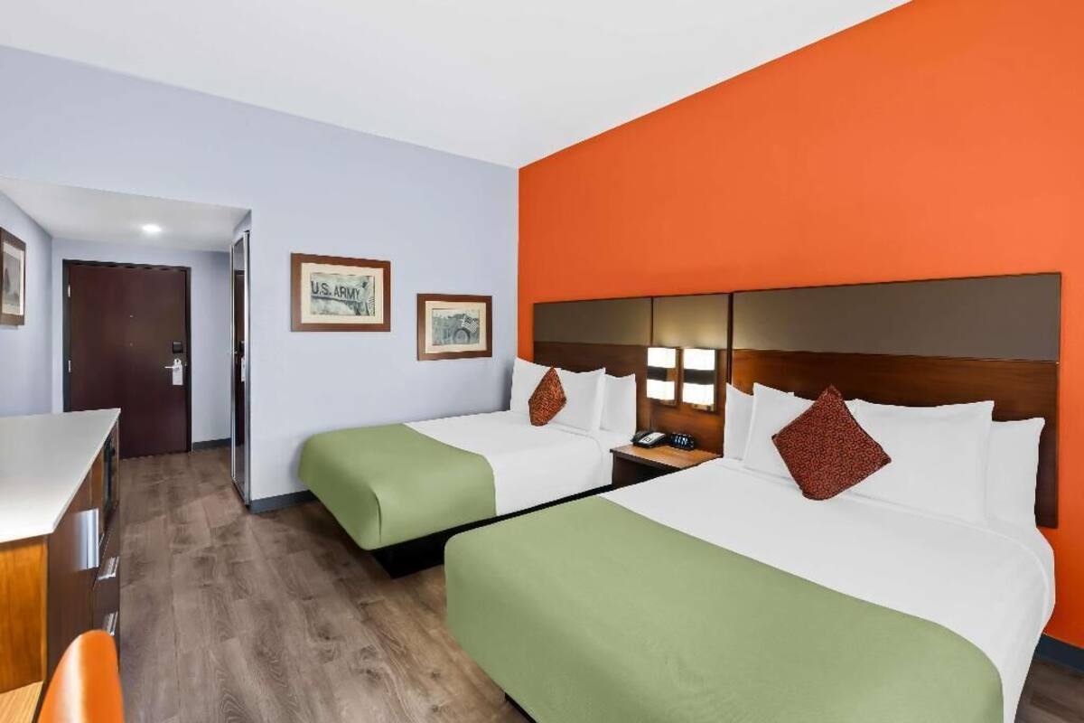 Premium bedding, pillow-top beds, desk, laptop workspace