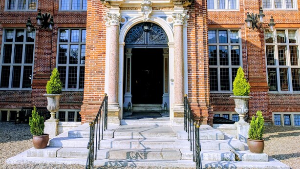 A brick building with a grand entrance, large windows, and a staircase leading up to the door. - Broome Park Hotel (Canterbury)