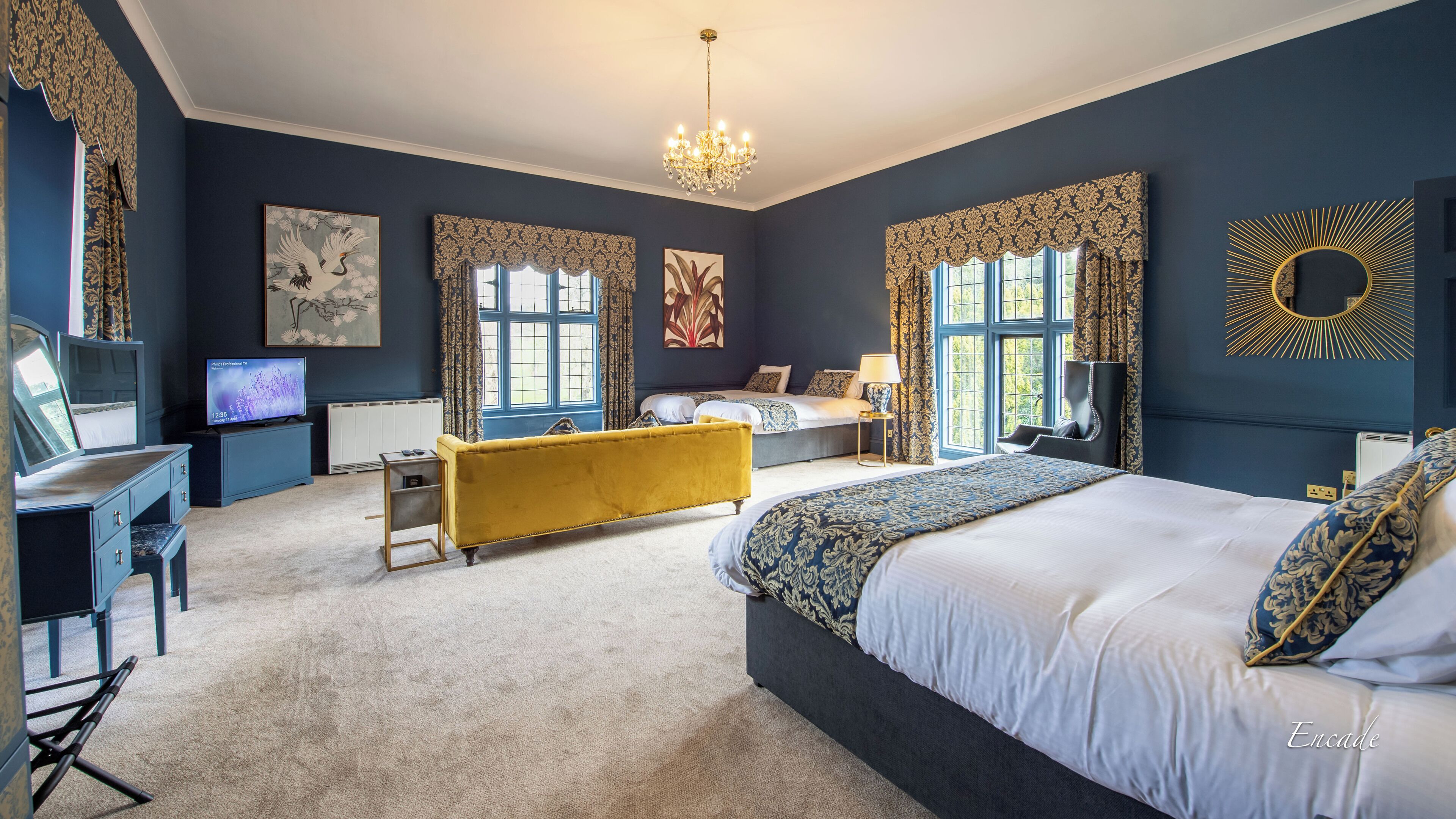 Deluxe Quadruple Room | In-room safe, individually decorated, desk, iron/ironing board