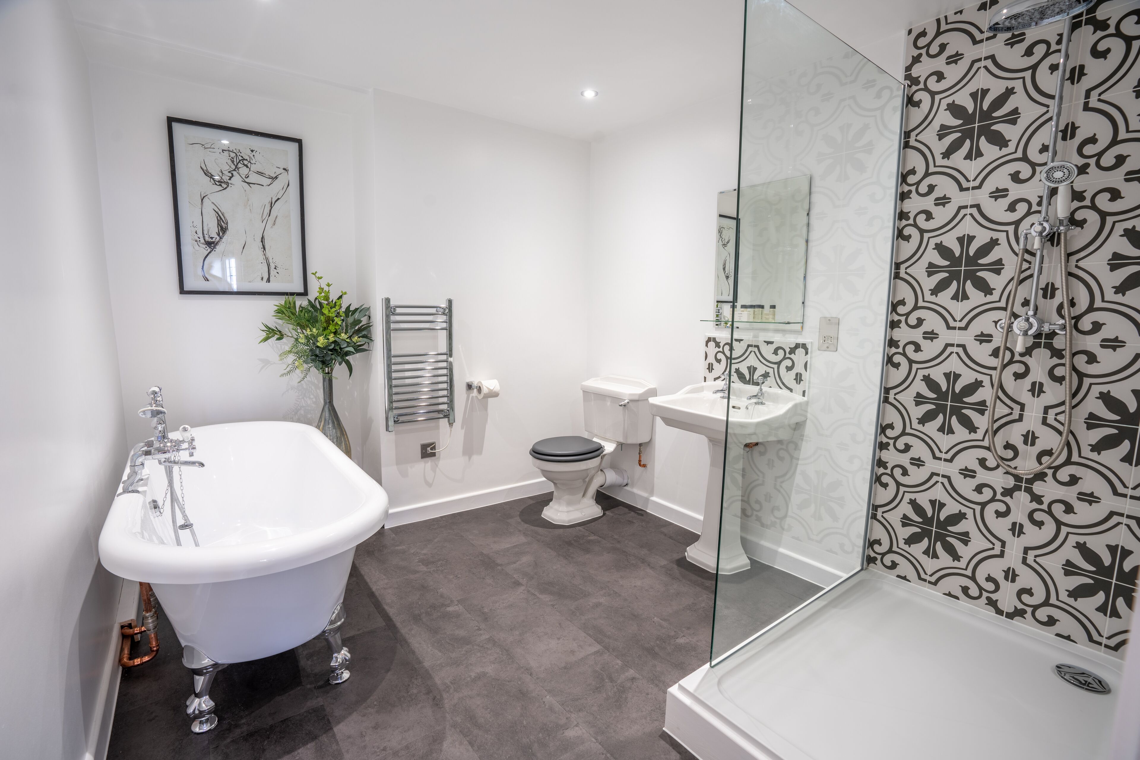 suite, 1 king bed, garden view | bathroom | free toiletries, hair dryer, towels, toilet paper