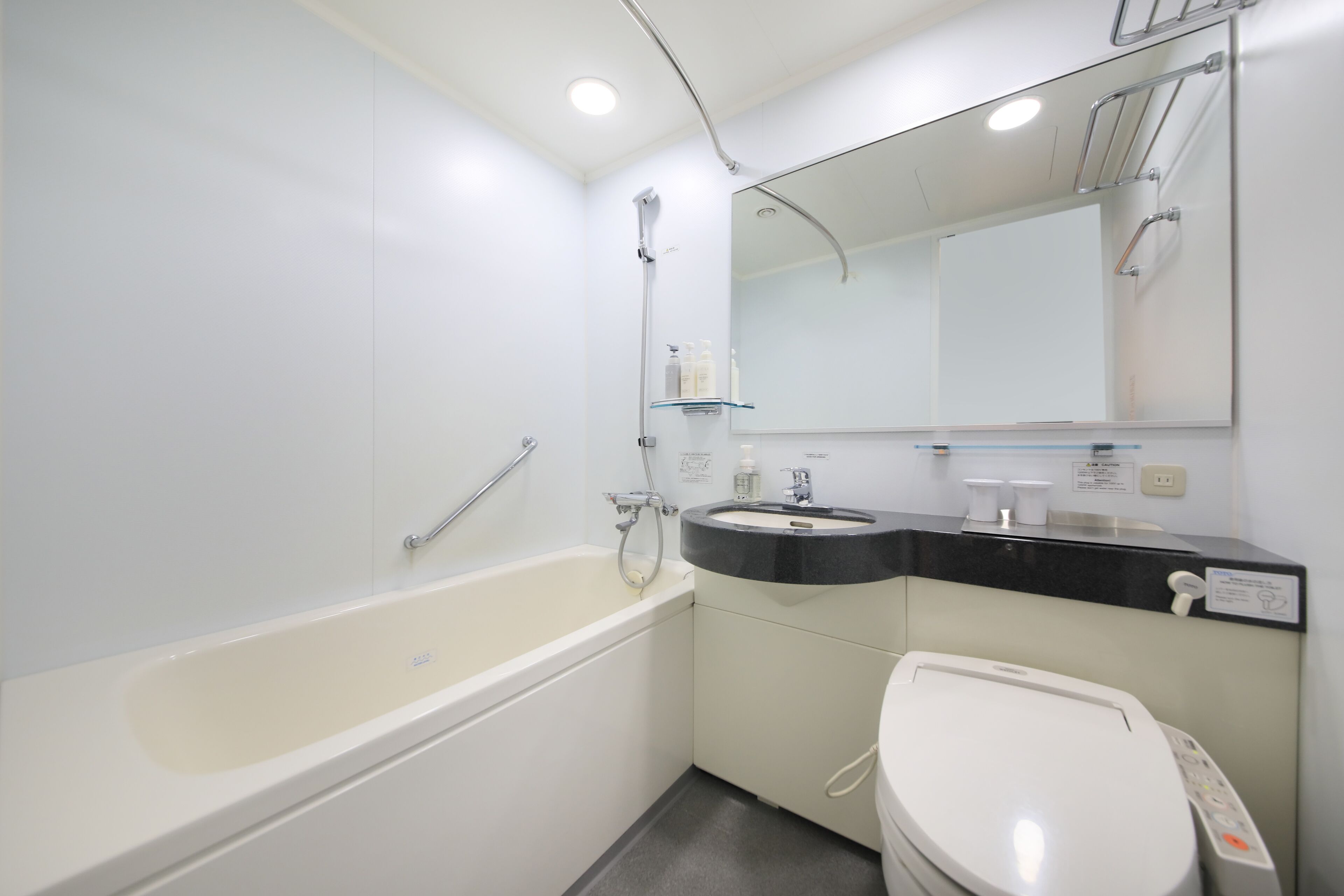 combined shower/bathtub, free toiletries, hair dryer, slippers