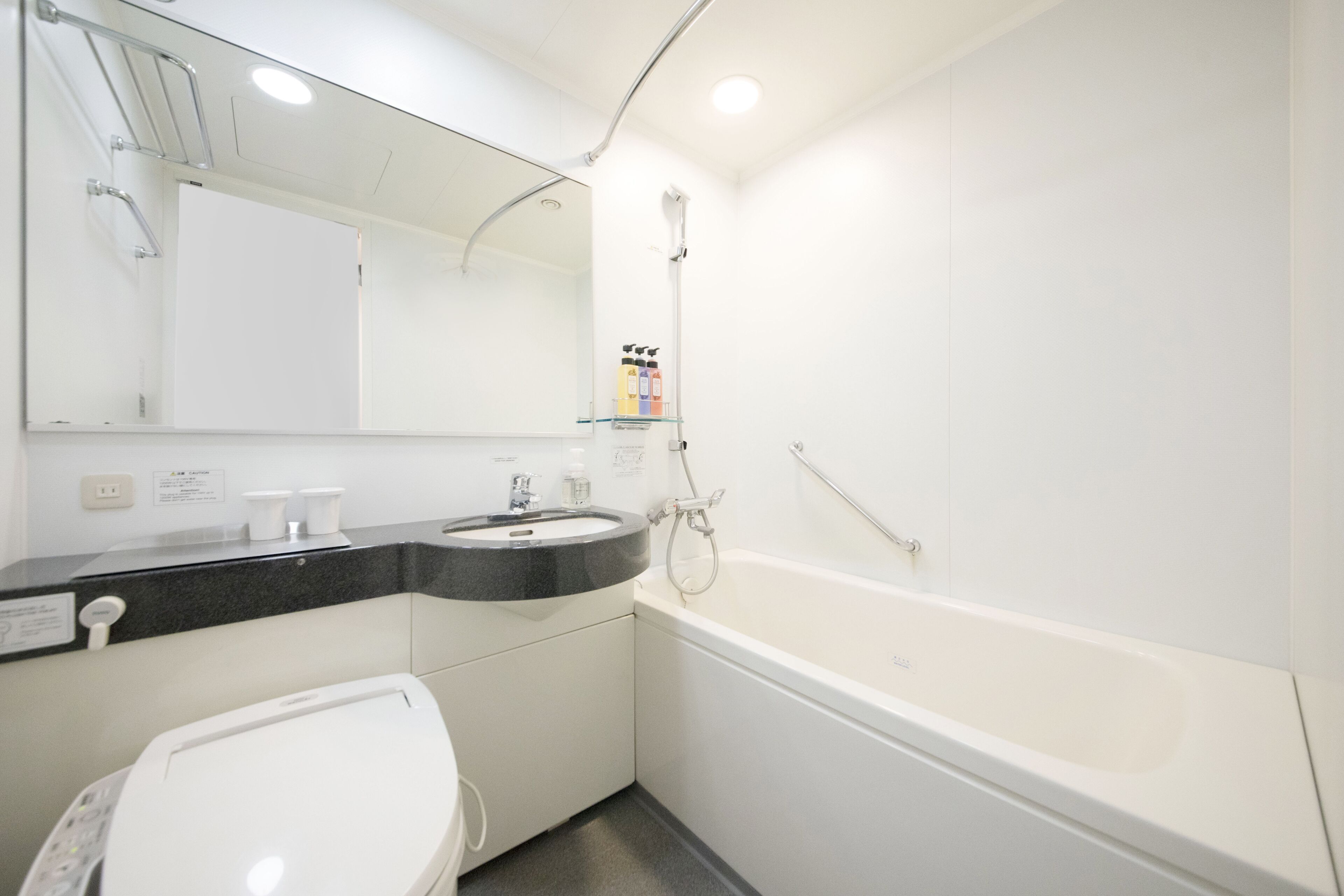 combined shower/bathtub, free toiletries, hair dryer, slippers