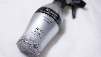 A bottle of Resesh deodorant with a spray nozzle.